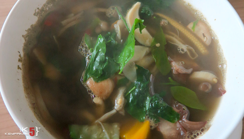 ฿60 THB - Isan mushroom soup with fermented fish sauce